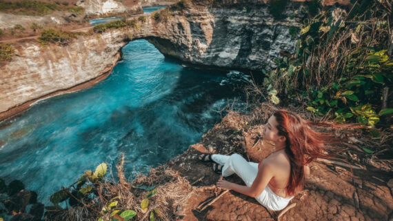 Travel woman looking view of broken beach, Nusa Penida island Bali ,Indonesia